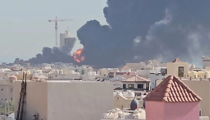 Emergency teams responding to a fire at a Kuwait power and water facility after reported Iranian strikes.