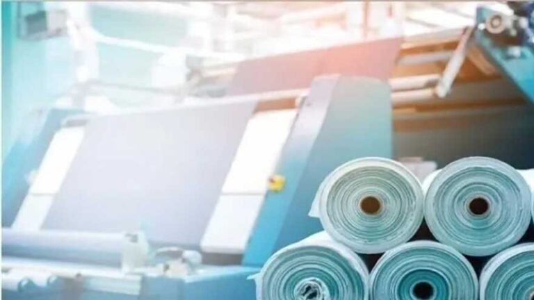 Shipping containers and textile goods representing Pakistan's textile exports and international trade.