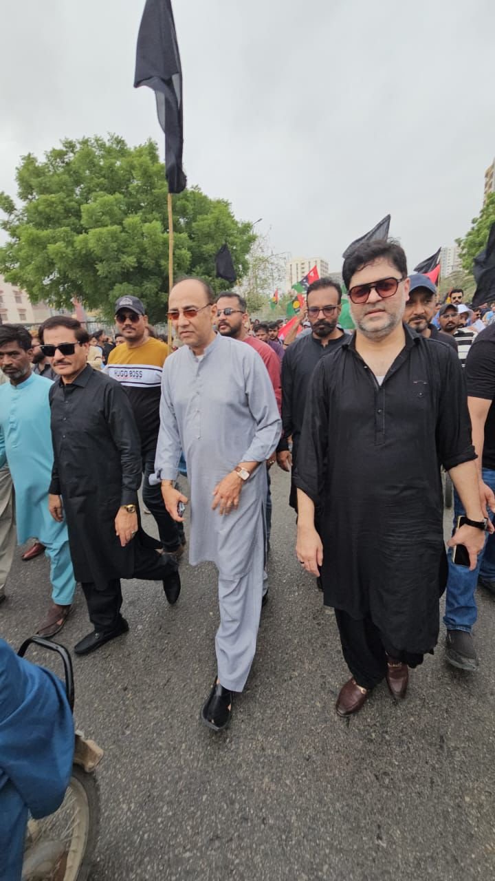 PPP leaders and supporters march during a Black Day rally in Karachi's District Central.