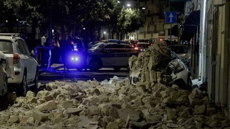 People standing outdoors after the magnitude 4.7 Naples earthquake in the Campi Flegrei volcanic area.