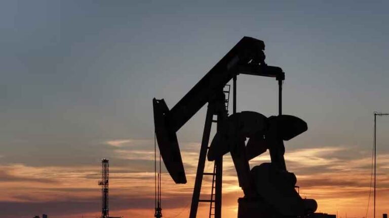Oil barrels and market charts amid rising crude prices and Strait of Hormuz tensions