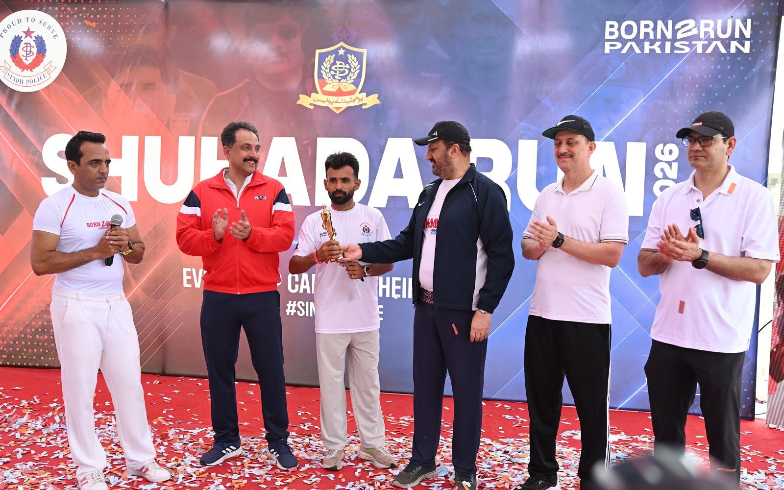 Participants and Sindh Police officers during the Shuhada Run 2026 held in Karachi.